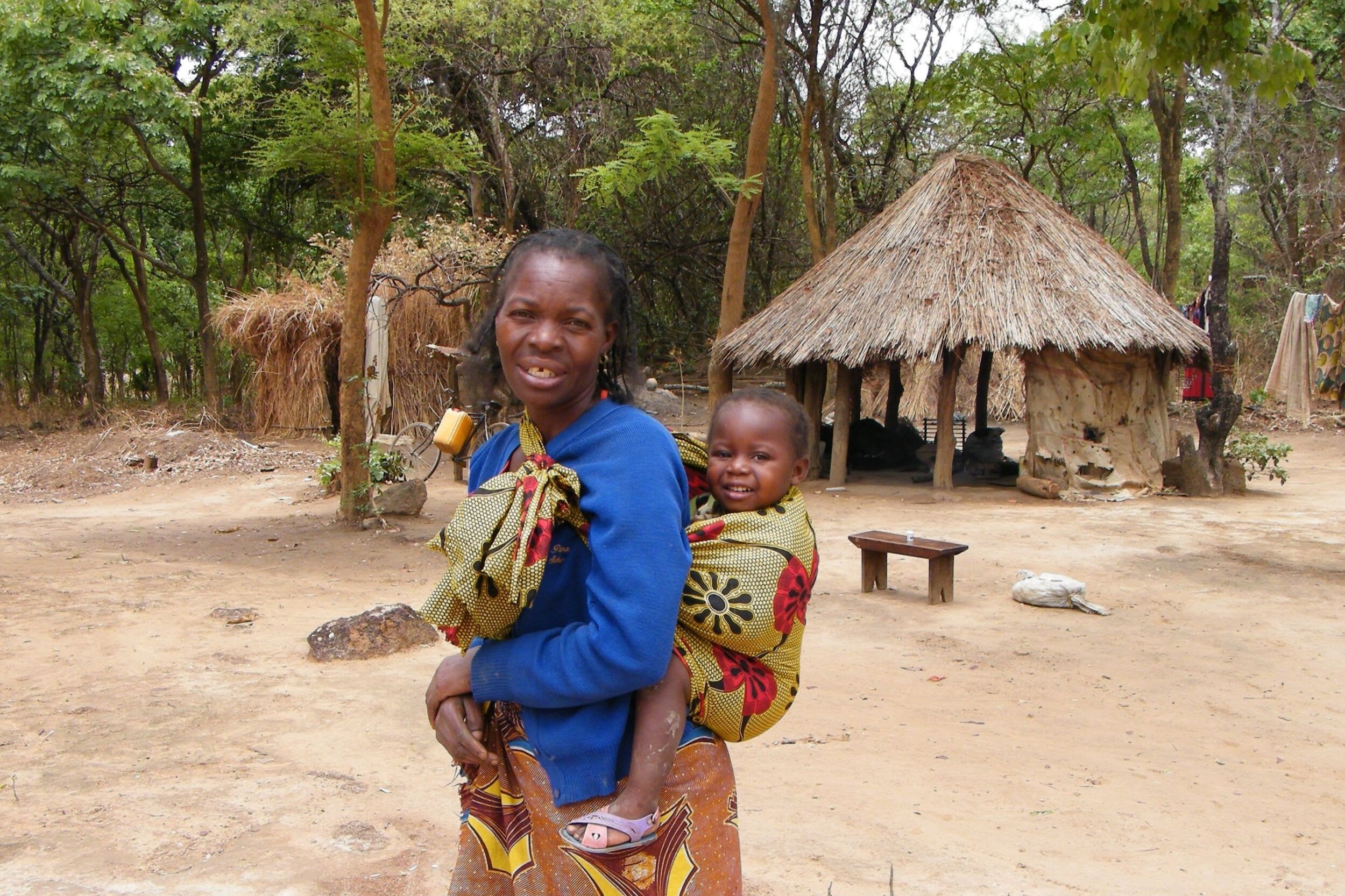 A woman carrying her child