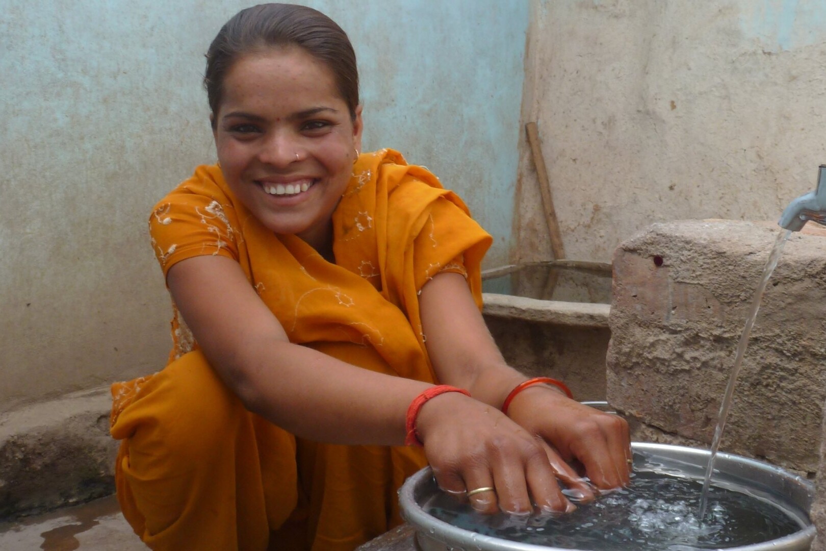 woman washes hands