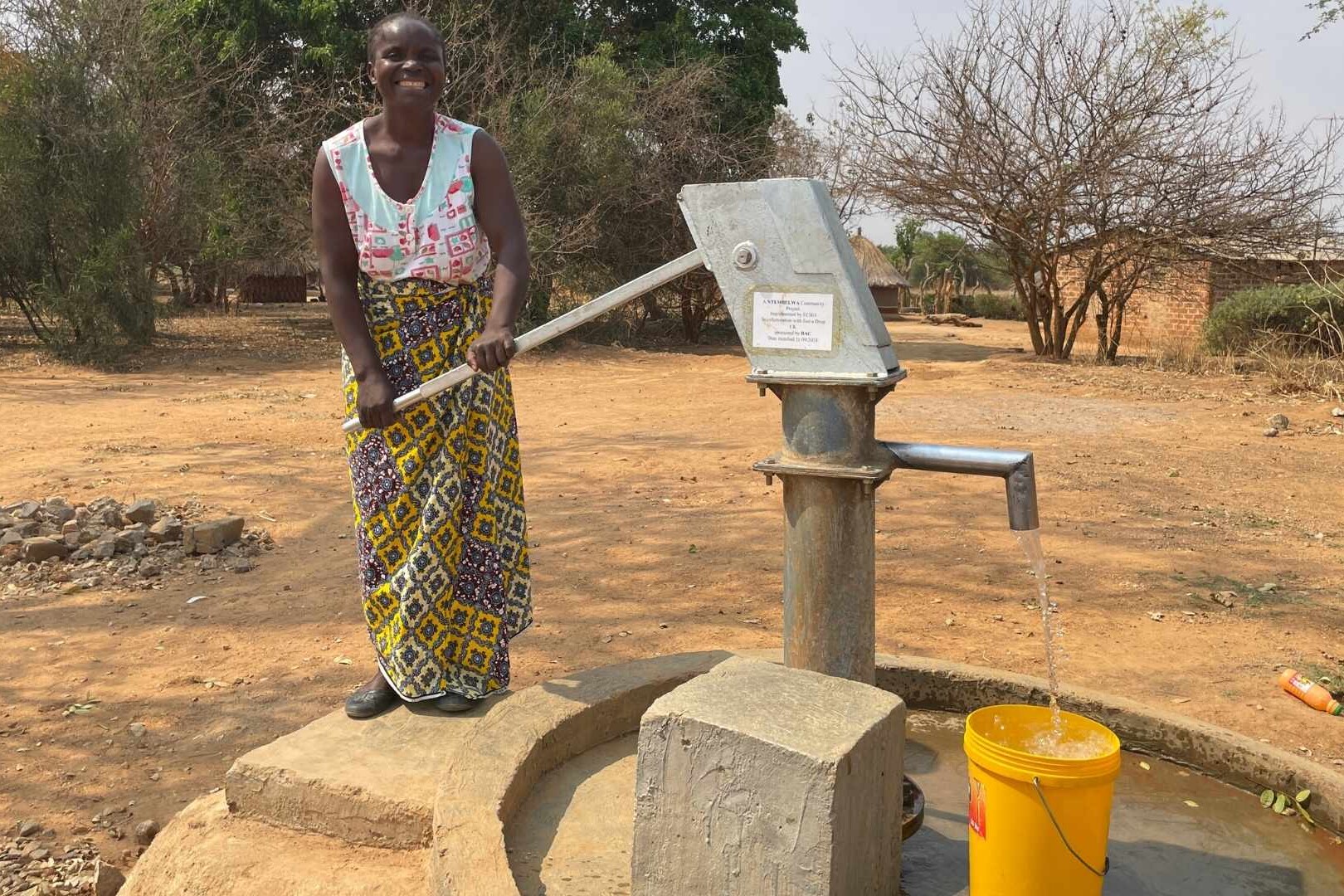 woman with borehole pump