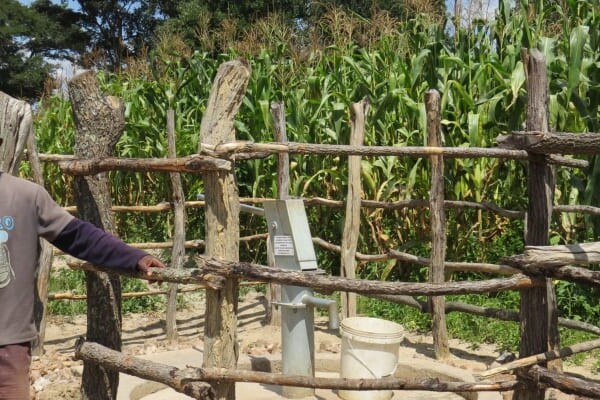 man with borehole pump