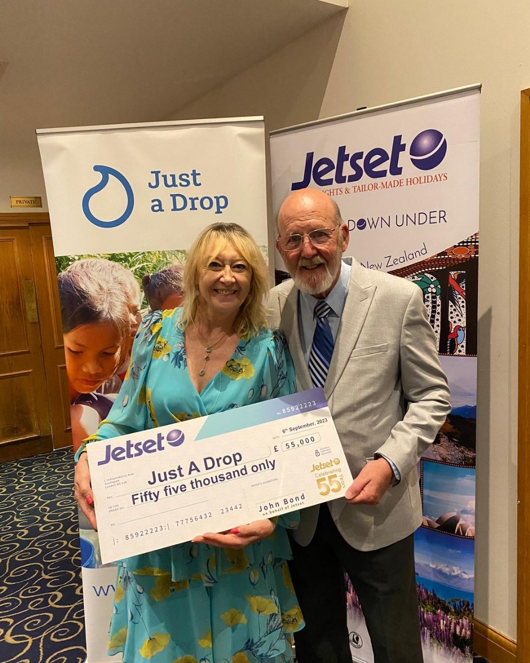 john bond presents fiona with charity check