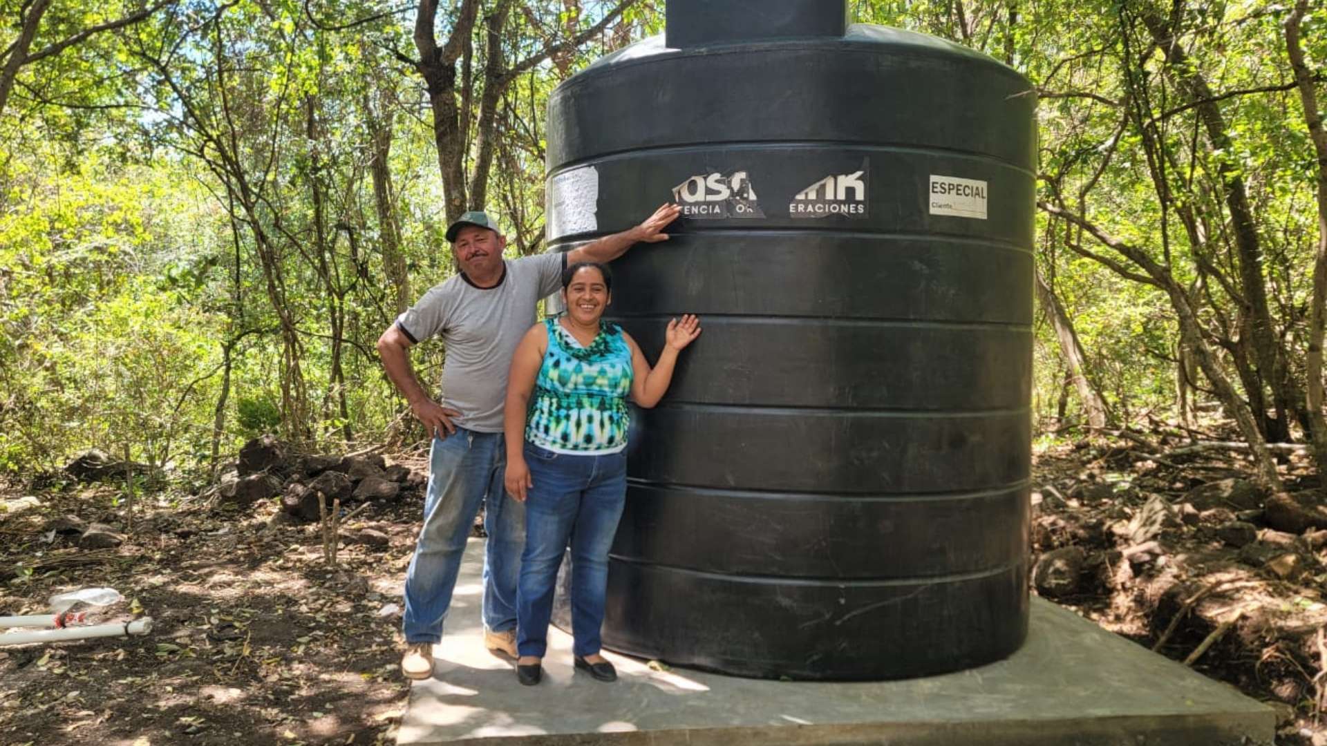 community members with water tank