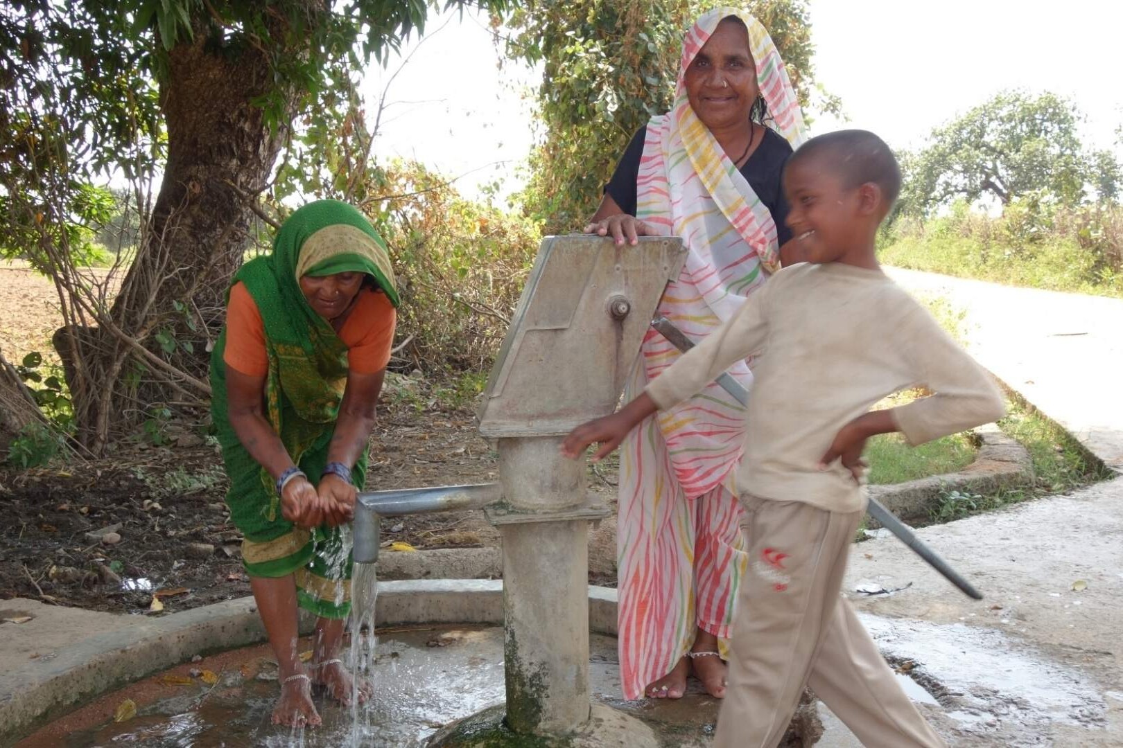 family with water pump