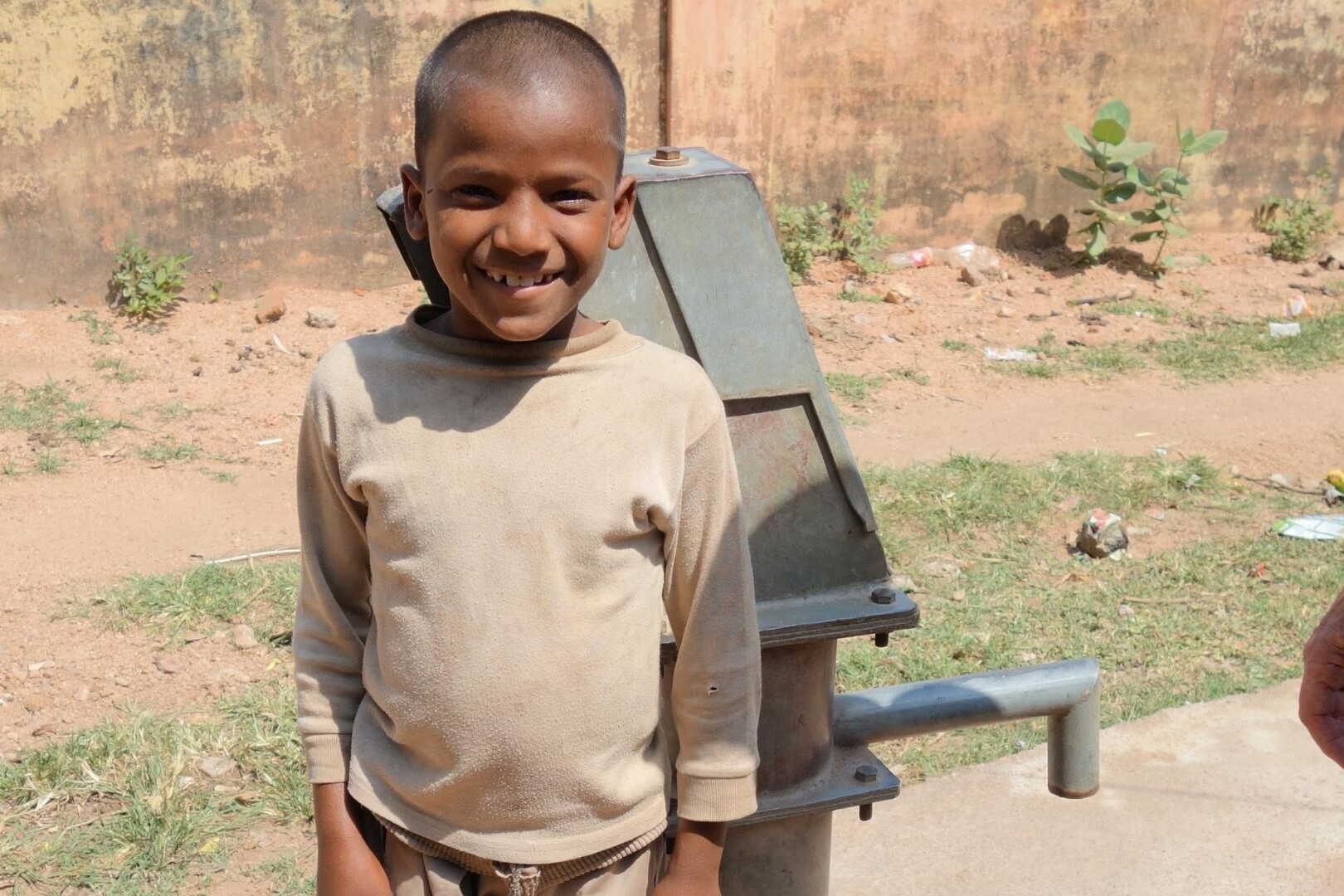 child with water pump