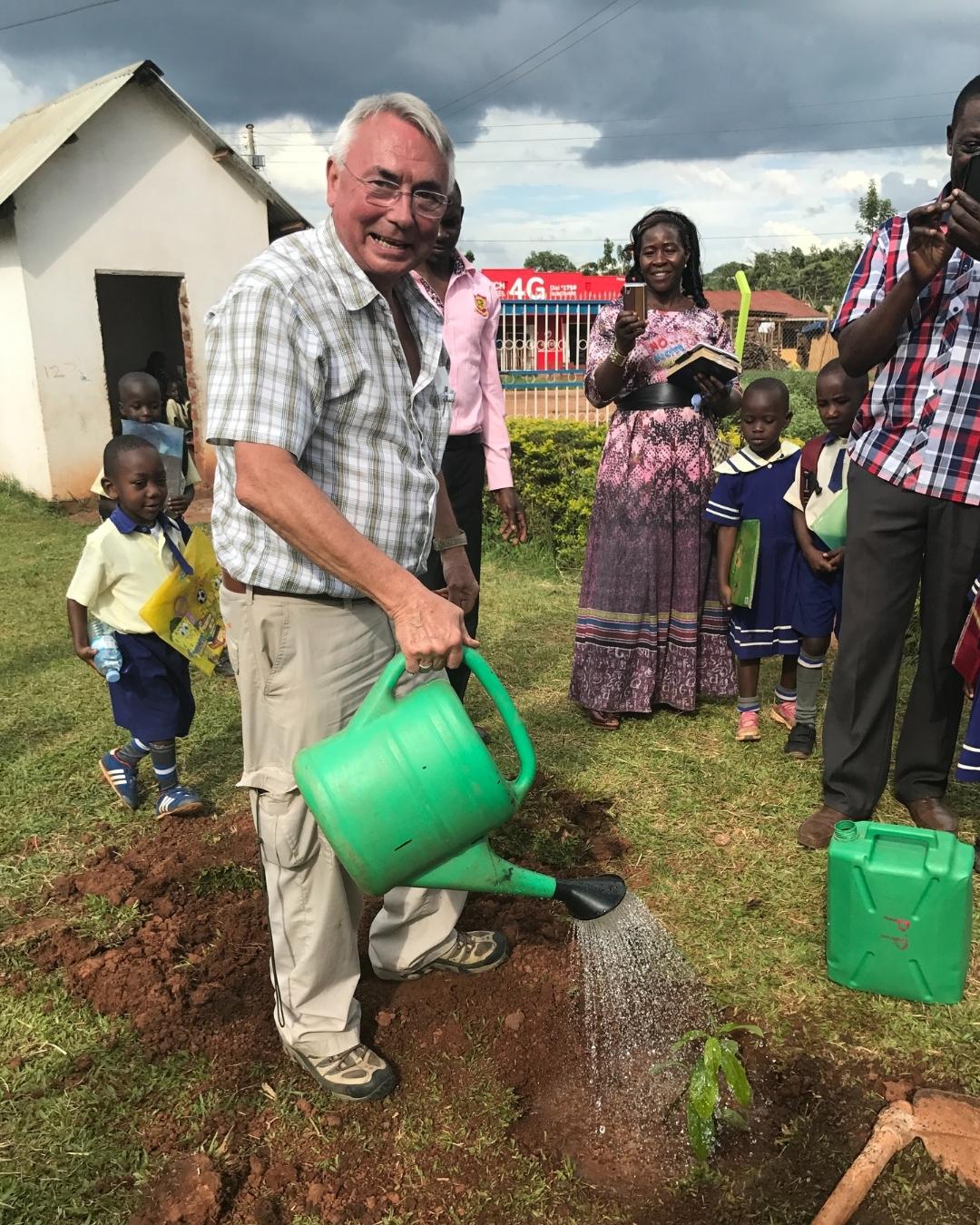 mike watering a tree